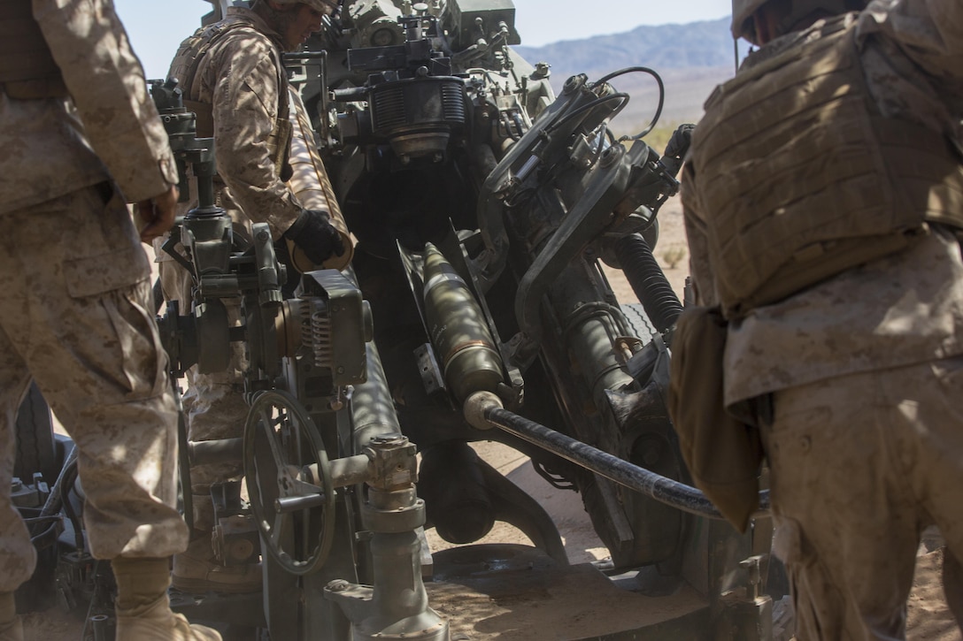 Marines with 3rd Battalion, 11th Marine Regiment, prepare to fire a 155mm M777A2 Lightweight Towed Howitzer in the Lead Mountain Training Area aboard the Marine Corps Air Ground Combat Center Twentynine Palms, Calif., May 3, 2016. (Official Marine Corps photo by Lance Cpl. Levi Schultz/Released)