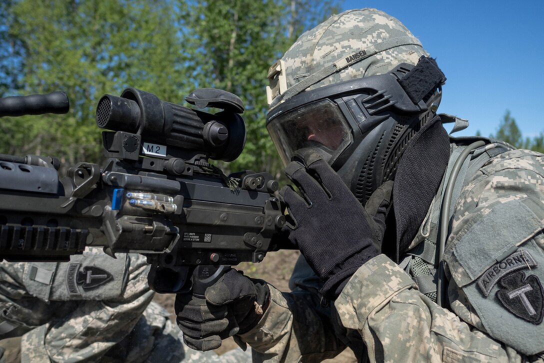 Alaska Army National Guard Spc. Allen Hansen, B Company, 1st Battalion (Airborne), 143rd Infantry Regiment, engages opposing forces during an individual-movement techniques lane May 14, 2016, at the Alaska National Guard's Alcantra Armory in Wasilla. During IMT, Soldiers provide covering fire, while a battle buddy bounds to cover.