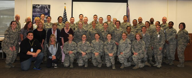 Airmen and civilians of the 28th Medical Group pose for a group photo at Ellsworth Air Force Base, S.D., May 9, 2016. In recognition of the 2016 National Nurses Week, the 28th MDG hosted Nurse and Medical Technician Appreciation Week from May 6 through 12. (U.S. Air Force photo by Airman Donald Knechtel/Released)
