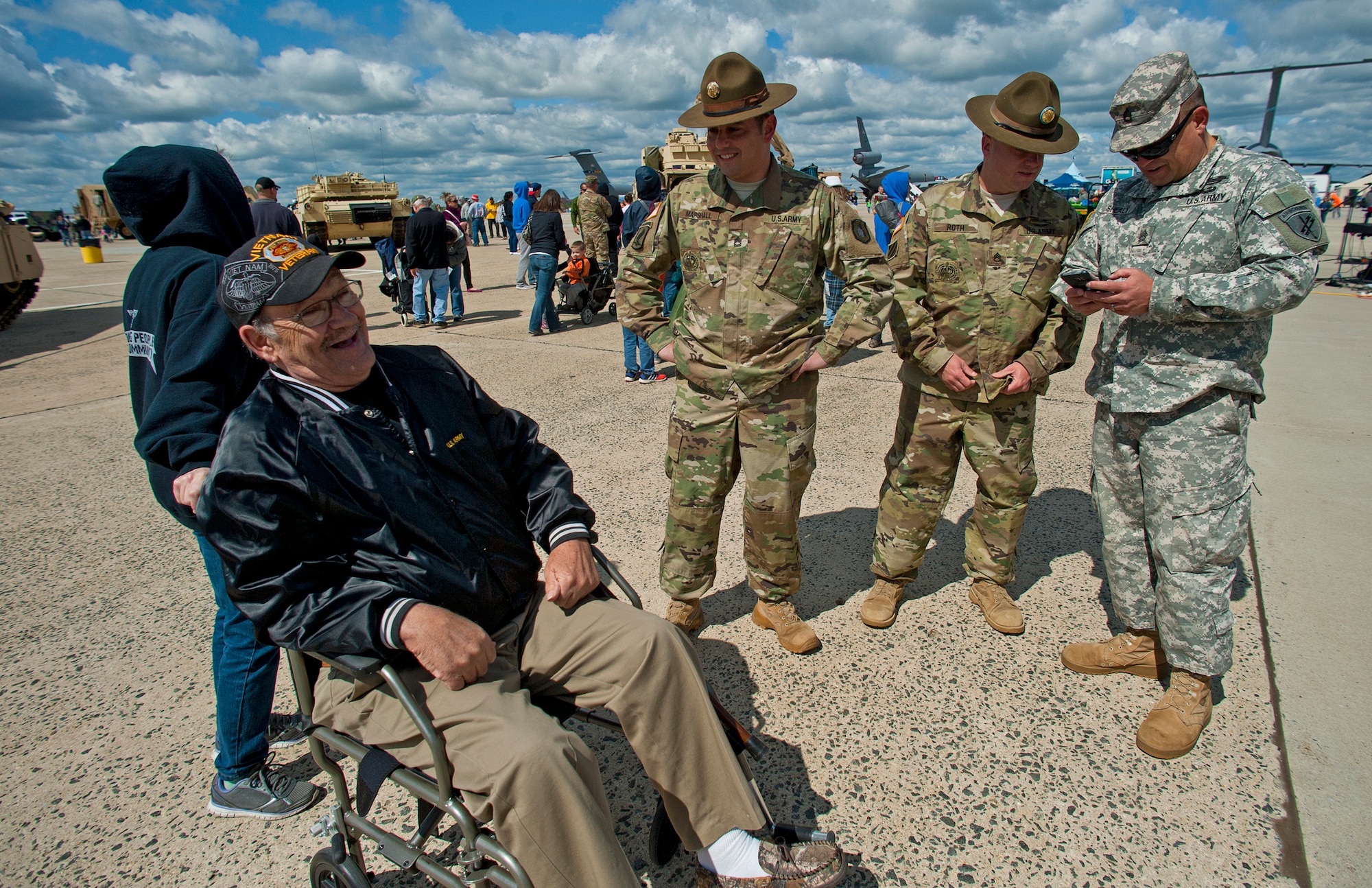 Ken McAllister of Manahawken, N.J. reminisces about his time in the service with Army drill instructors at the Power in the Pines Open House and Air Show at Joint Base McGuire-Dix-Lakehurst, N.J. May 15. As the nation’s only tri-service joint base, JB MDL’s Power in the Pines Open House and Air Show boasts demonstrations from each branch of the armed forces. (U.S. Air Force photo by Christian DeLuca)