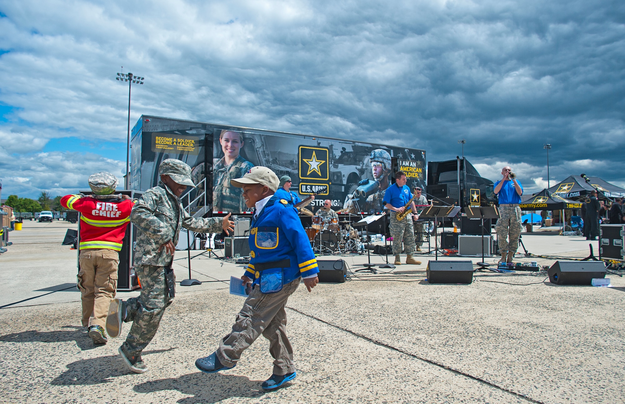 Kids enjoy the music of the 78th Army Band performing at the Power in the Pines Open House and Air Show at Joint Base McGuire-Dix-Lakehurst, N.J. May 15. As the nation???s only tri-service joint base, JB MDL???s Power in the Pines Open House and Air Show boasts demonstrations from each branch of the armed forces. (U.S. Air Force photo by Christian DeLuca/released)