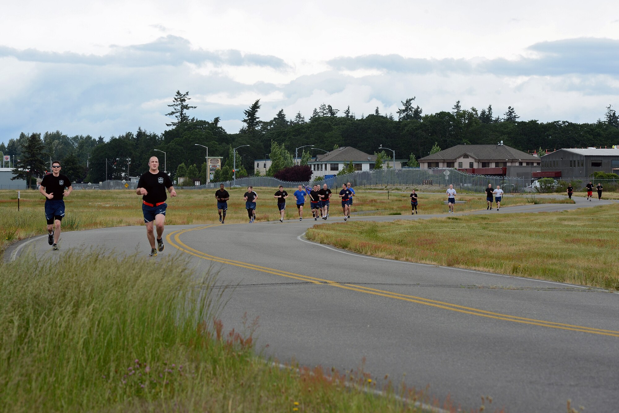Airmen from the 62nd Aerial Port Squadron run in the squadron’s 5K memorial run May 18, 2016, on Joint Base Lewis-McChord, Wash. Collectively this year’s run raised $5,680 for the Fisher House Foundation through the sale of 380 shirts. (U.S. Air Force photo/Senior Airman Jacob Jimenez) 