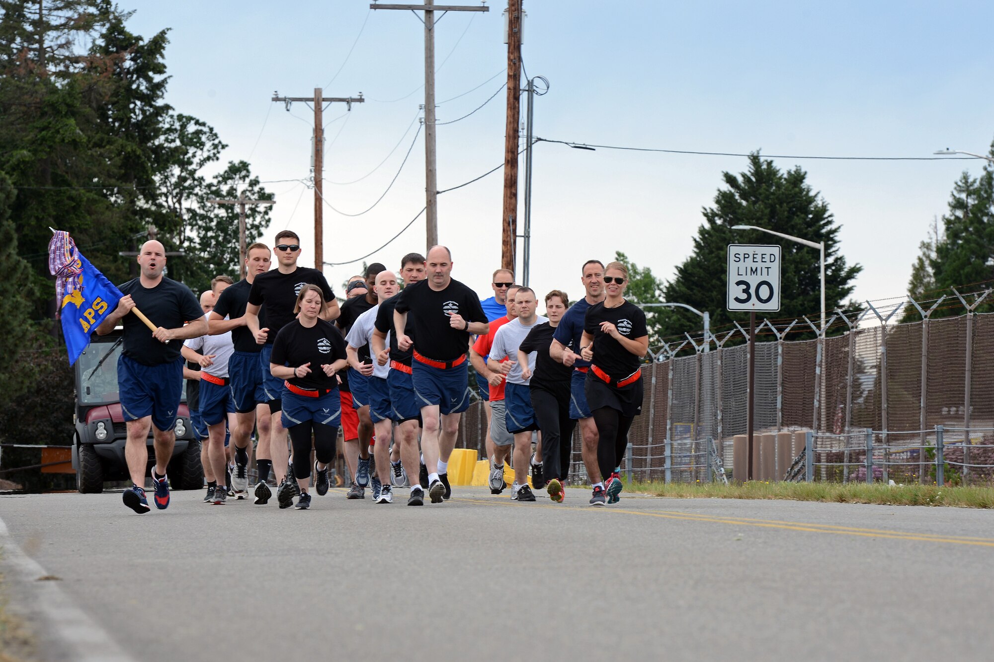 Airmen from the 62nd Aerial Port Squadron start the 62nd APS 5K Memorial Run in formation May 18, 2016, on Joint Base Lewis-McChord, Wash. The memorial run, an annual tradition among port dawgs, is done to honor all aerial porters known as port dawgs that have passed on. (U.S. Air Force photo/ Senior Airman Jacob Jimenez) 