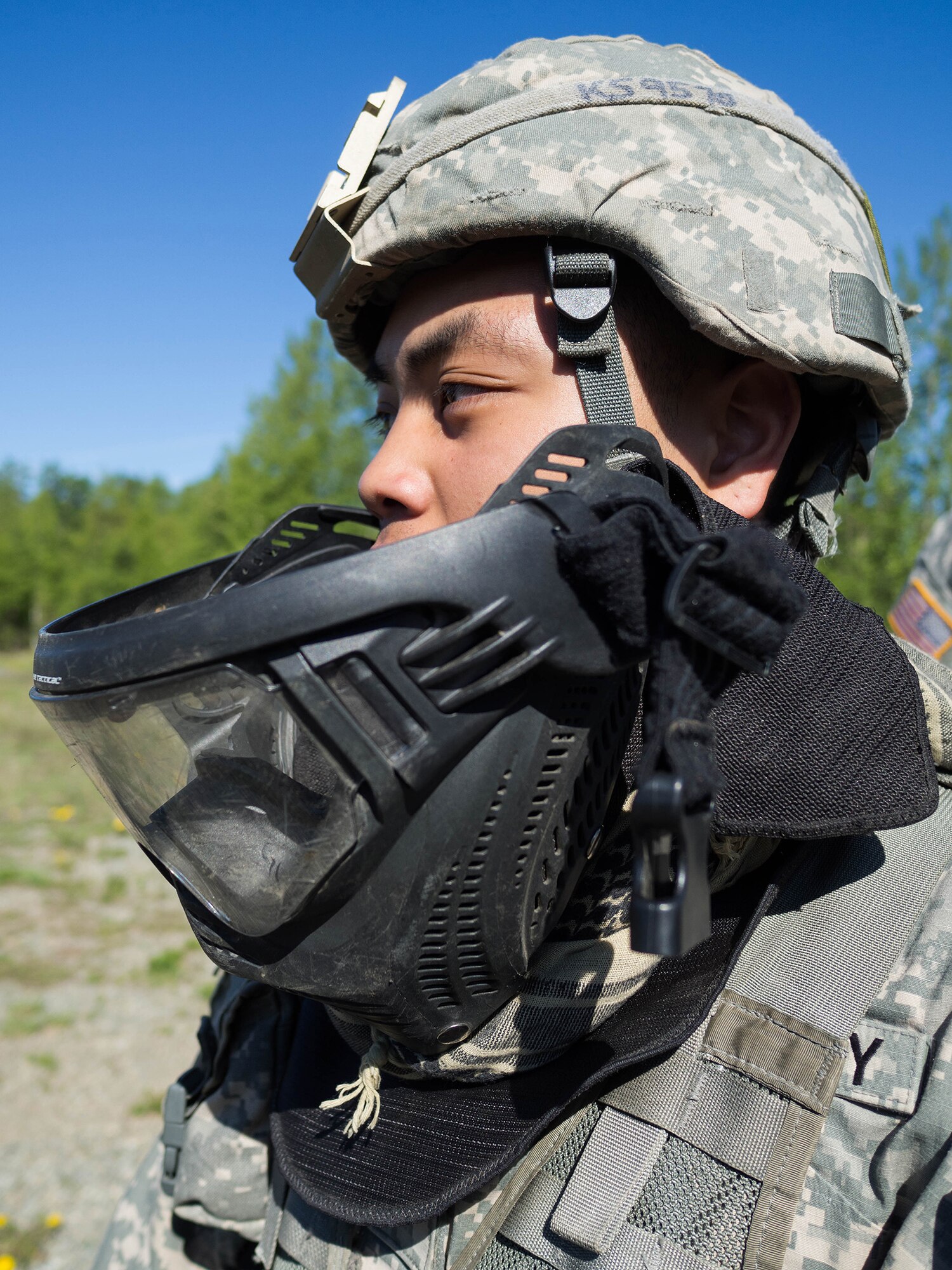 Alaska Army National Guard Spc. Kanoa Singson, B Company, 1st Battalion (Airborne), 143rd Infantry Regiment, listens to a brief before venturing out on an individual-movement techniques lane May 14, 2016, at the Alaska National Guard's Alcantra Armory in Wasilla. Soldiers used paint-marker training munitions to make the training more realistic. (U.S. Army National Guard photo by Sgt. David Bedard)