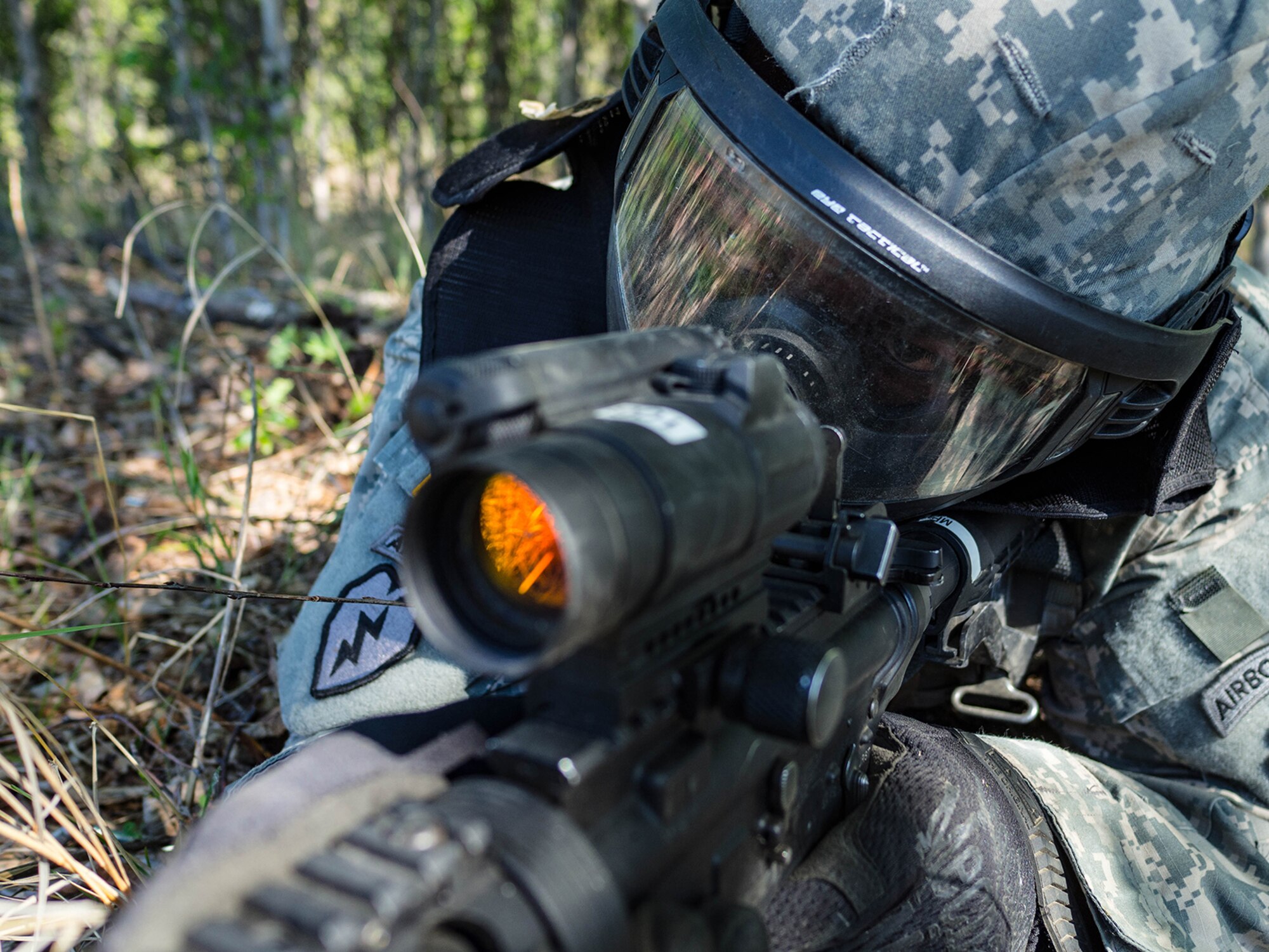 Alaska Army National Guard Spc. Innocent Bennett, B Company, 1st Battalion (Airborne), 143rd Infantry Regiment, engages opposing forces during an individual-movement techniques lane May 14, 2016, at the Alaska National Guard's Alcantra Armory in Wasilla. Soldiers used paint-marking training rounds to up the stakes for the training that is usually conducted using laser-based training devices. (U.S. Army National Guard photo by Sgt. David Bedard)