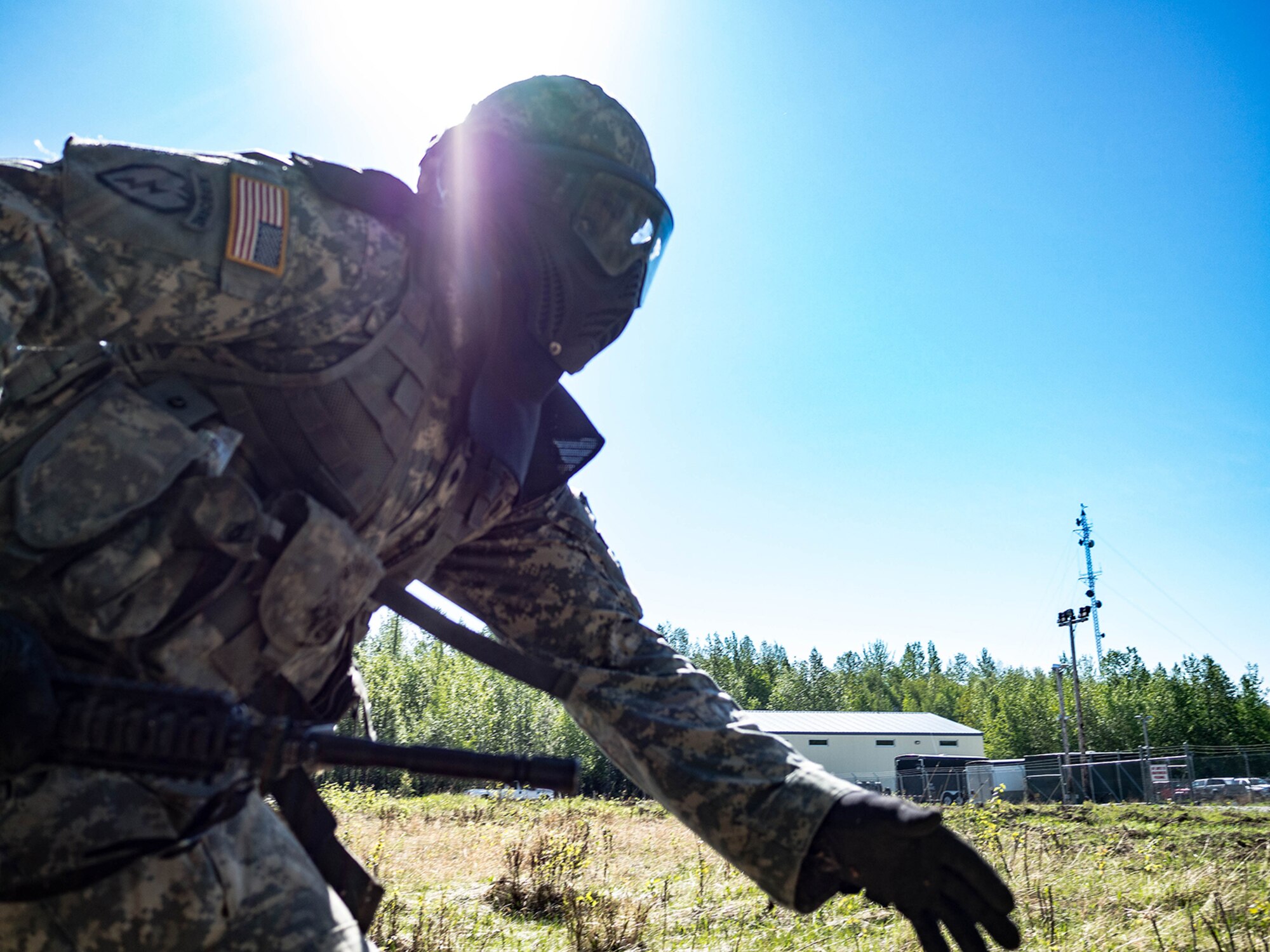 Alaska Army National Guard Spc. Innocent Bennett, B Company, 1st Battalion (Airborne), 143rd Infantry Regiment, bounds during an individual-movement techniques lane May 14, 2016, at the Alaska National Guard's Alcantra Armory in Wasilla. Individual-movement training is the foundation for all infantry maneuver tactics. (U.S. Army National Guard photo by Sgt. David Bedard)