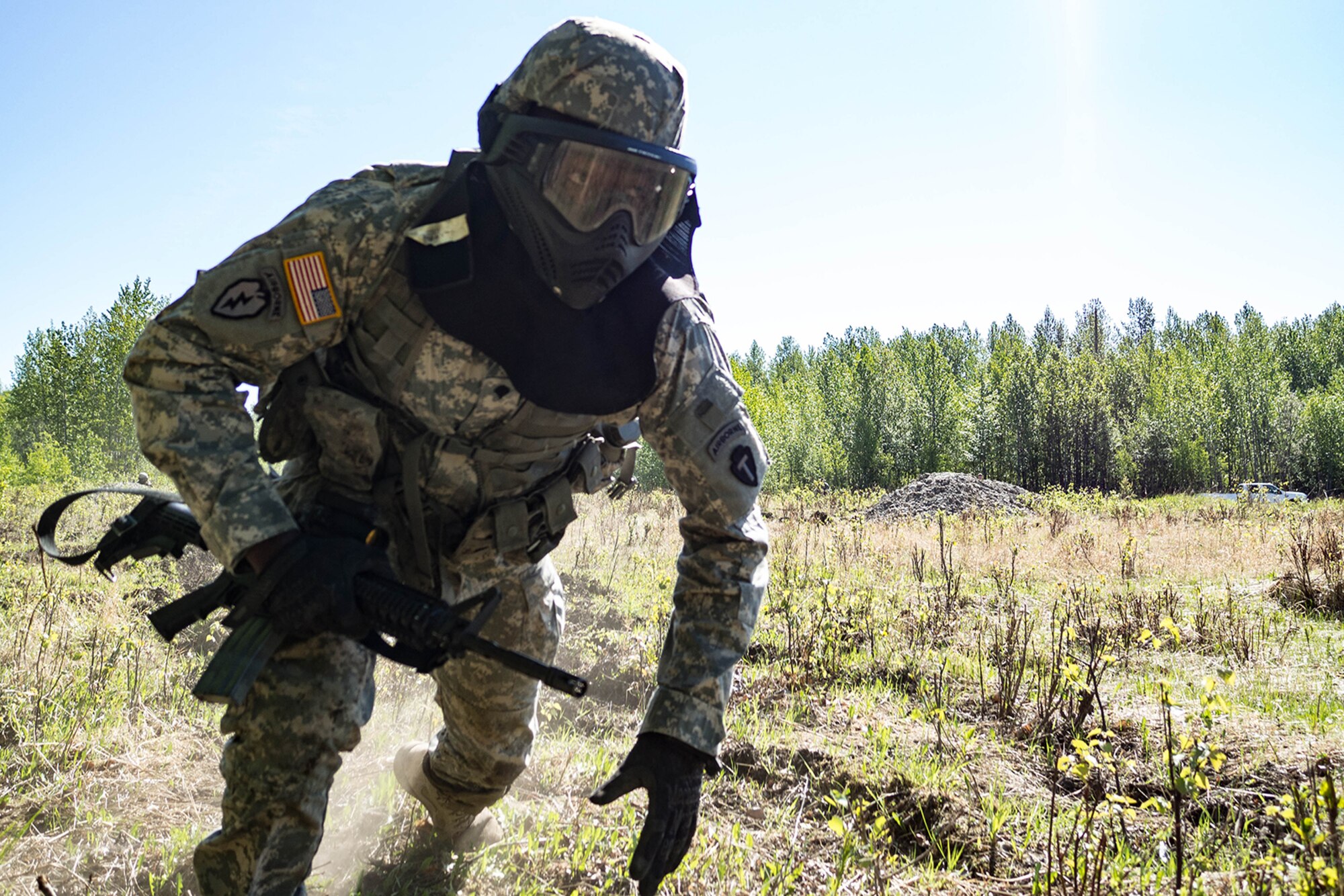 Alaska Army National Guard Spc. Innocent Bennett, B Company, 1st Battalion (Airborne), 143rd Infantry Regiment, bounds during an individual-movement techniques lane May 14, 2016, at the Alaska National Guard's Alcantra Armory in Wasilla. Individual-movement training is the foundation for all infantry maneuver tactics. (U.S. Army National Guard photo by Sgt. David Bedard)