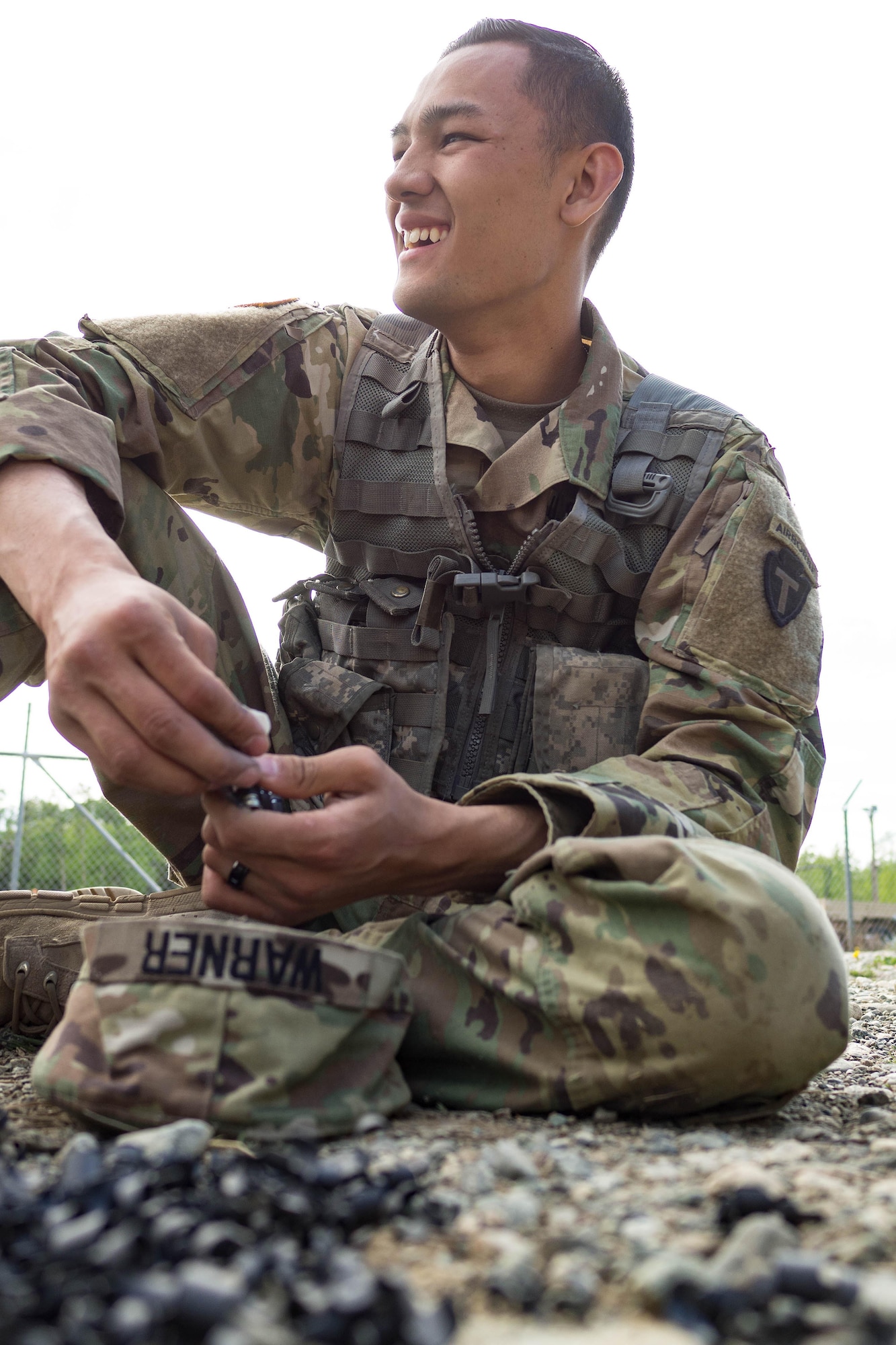 Alaska Army National Guard Spc. Flint Warner, B Company, 1st Battalion (Airborne), 143rd Infantry Regiment, de-links paint-marker training munitions during an individual-movement techniques lane May 14, 2016, at the Alaska National Guard's Alcantra Armory in Wasilla. Soldiers used paint-marking training rounds to up the stakes for the training that is usually conducted using laser-based training devices. (U.S. Army National Guard photo by Sgt. David Bedard)