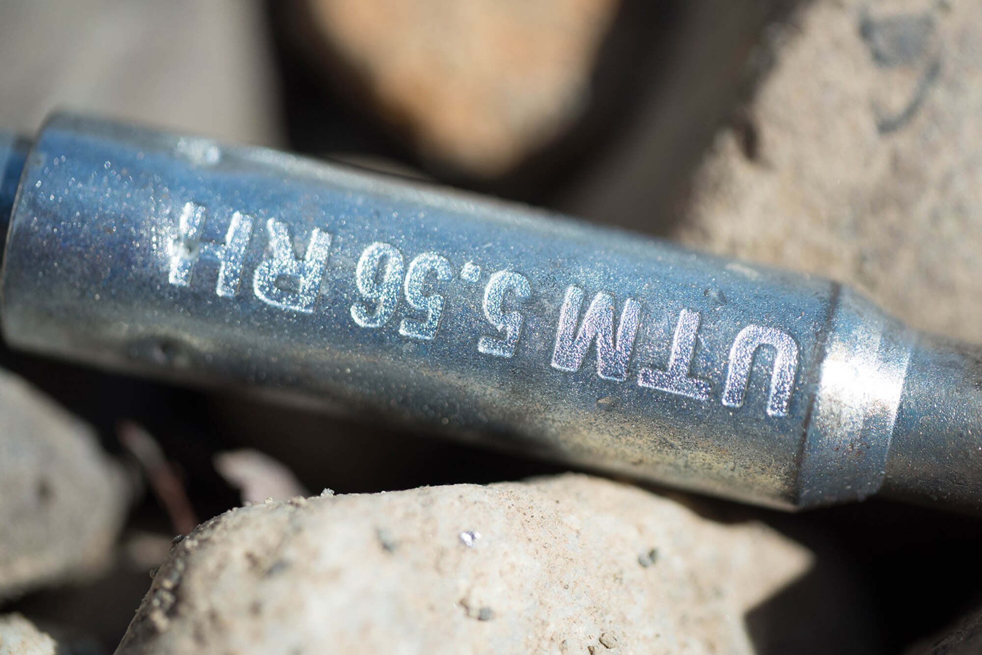 An expended paint-marker training munition rests May 14, 2016, at the Alaska National Guard's Alcantra Armory in Wasilla. The munitions were used for individual-movement techniques training. The rimfire munition uses a unique bolt to ensure no live ammunition can be fired. (U.S. Army National Guard photo by Sgt. David Bedard)