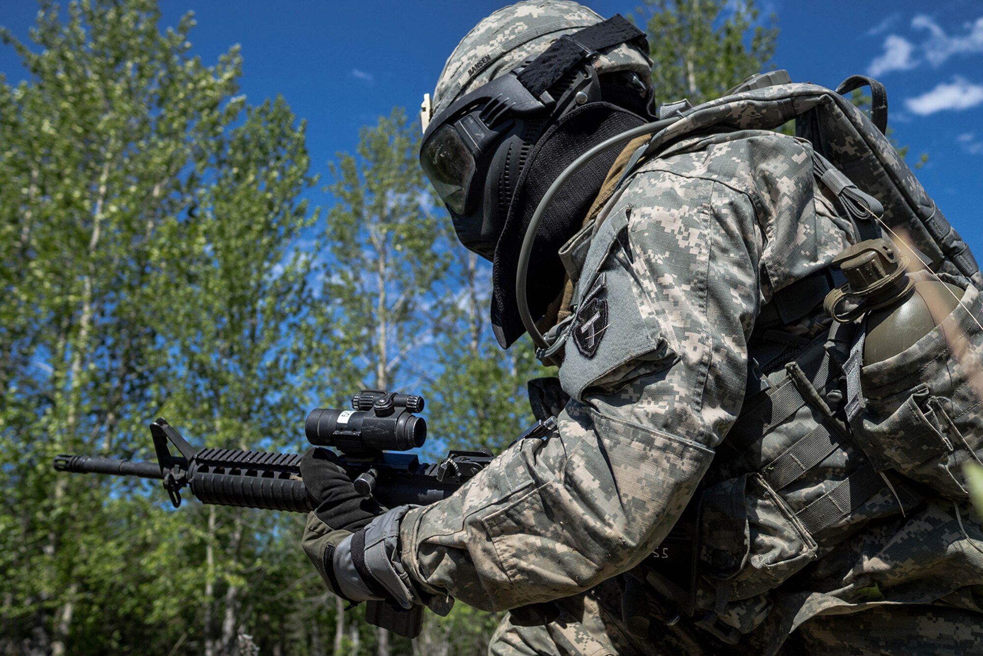 Alaska Army National Guard Spc. Allen Hansen, B Company, 1st Battalion (Airborne), 143rd Infantry Regiment, bounds during an individual-movement techniques lane May 14, 2016, at the Alaska National Guard's Alcantra Armory in Wasilla. During IMT, Soldiers provide covering fire, while a battle buddy bounds to cover. (U.S. Army National Guard photo by Sgt. David Bedard)