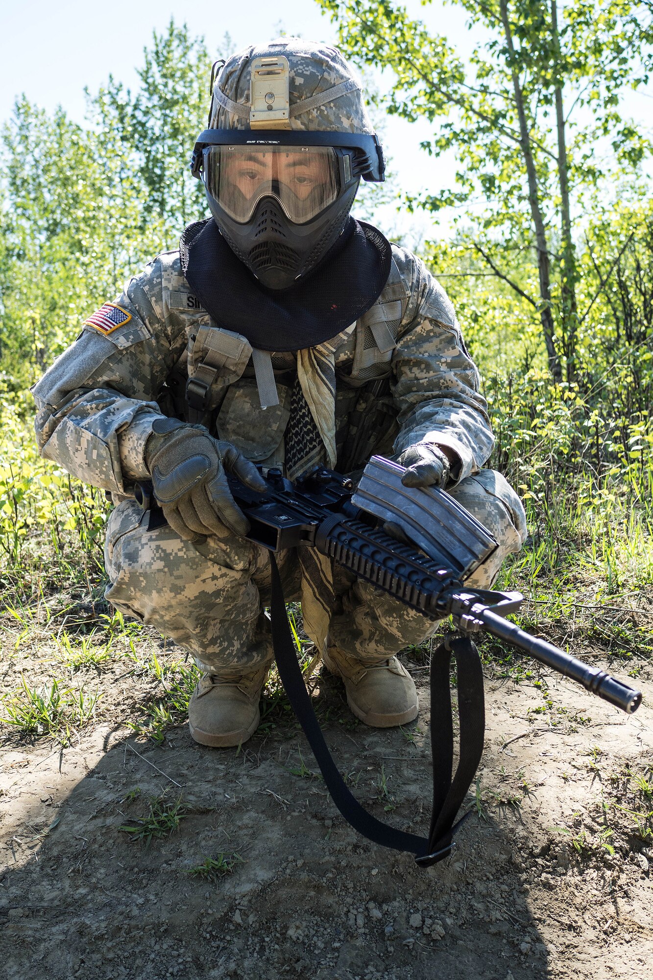 Alaska Army National Guard Spc. Kanoa Singson, B Company, 1st Battalion (Airborne), 143rd Infantry Regiment, reflects before an individual-movement techniques lane May 14, 2016, at the Alaska National Guard's Alcantra Armory in Wasilla. Soldiers used paint-marking training munitions to make the training more realistic. (U.S. Army National Guard photo by Sgt. David Bedard)
