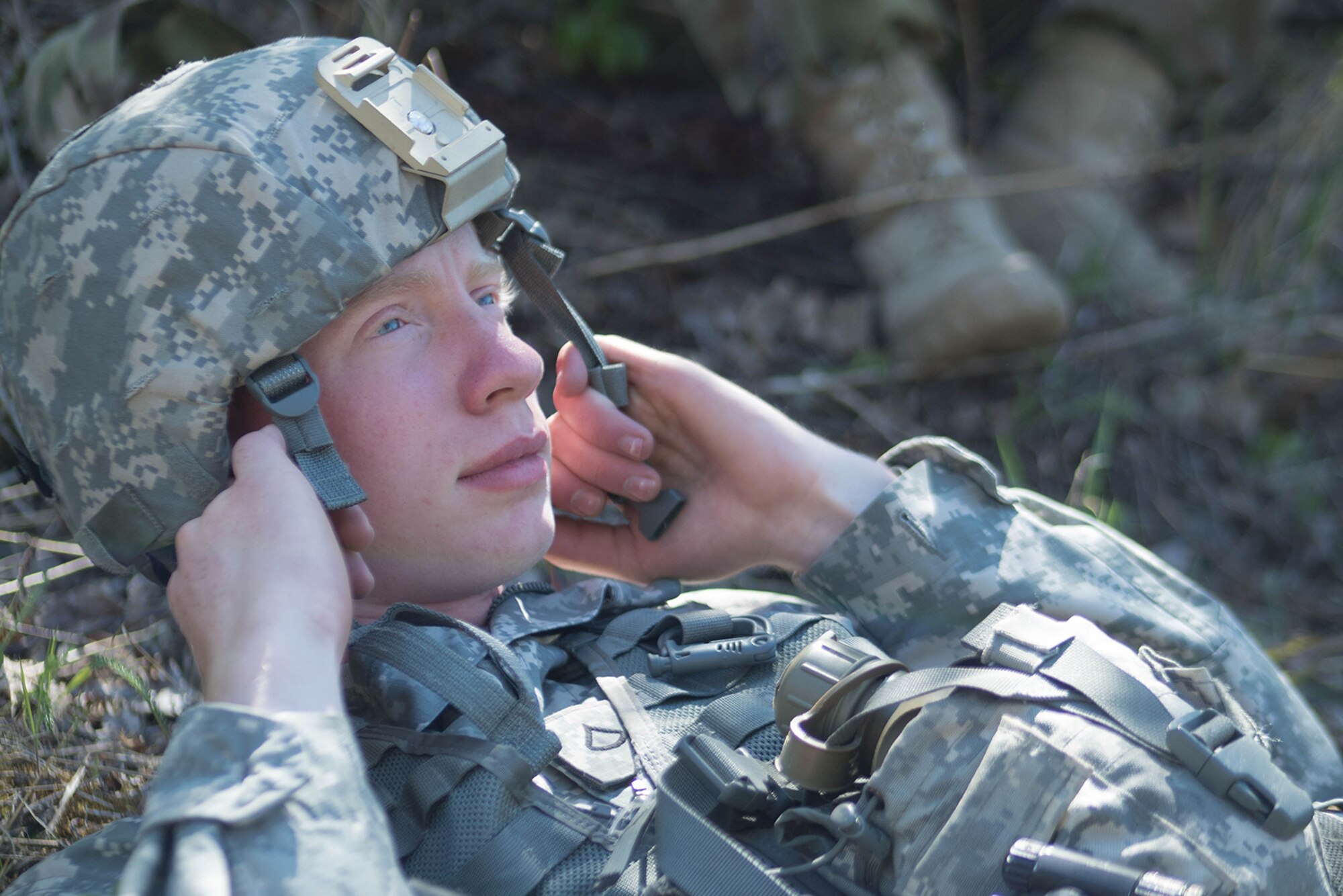 Alaska Army National Guard Pfc. Kolton Baker, B Company, 1st Battalion (Airborne), 143rd Infantry Regiment, takes a break following an individual-movement techniques lane May 14, 2016, at the Alaska National Guard's Alcantra Armory in Wasilla. Soldiers used paint-marking training rounds to up the stakes for the training that is usually conducted using laser-based training devices. (U.S. Army National Guard photo by Sgt. David Bedard)