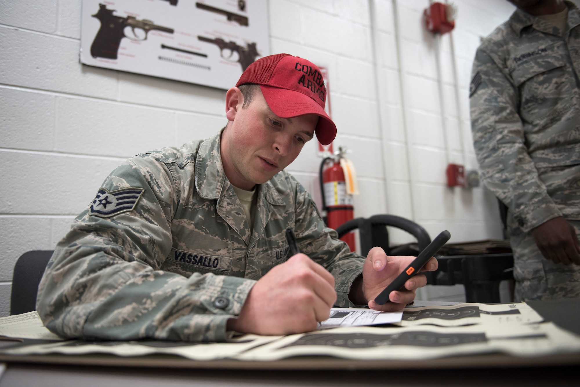 Staff Sgt. Alfred Vassallo, chief statistical officer, calculates scores of participants during the 2016 Elementary Level Excellence in Competition Rifle Match at Joint Base Andrews, Md., May 17. The EIC had 120 participants from active duty, the Guard and Reserve, and was one of several events on base celebrating National Police Week.  (U.S. Air Force photo by Airman 1st Class Philip Bryant)