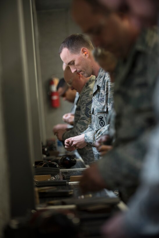 Master Sgt. Gregory Coleman, 811th Security Forces Squadron operations NCO in charge, loads a magazine during the 2016 Elementary Level Excellence in Competition Rifle Match at Joint Base Andrews, Md., May 17. Competition participants shot ten rounds standing, ten rounds from one knee, ten rounds from the cross-legged position and 20 rounds from the prone position. (U.S. Air Force photo by Airman 1st Class Philip Bryant)