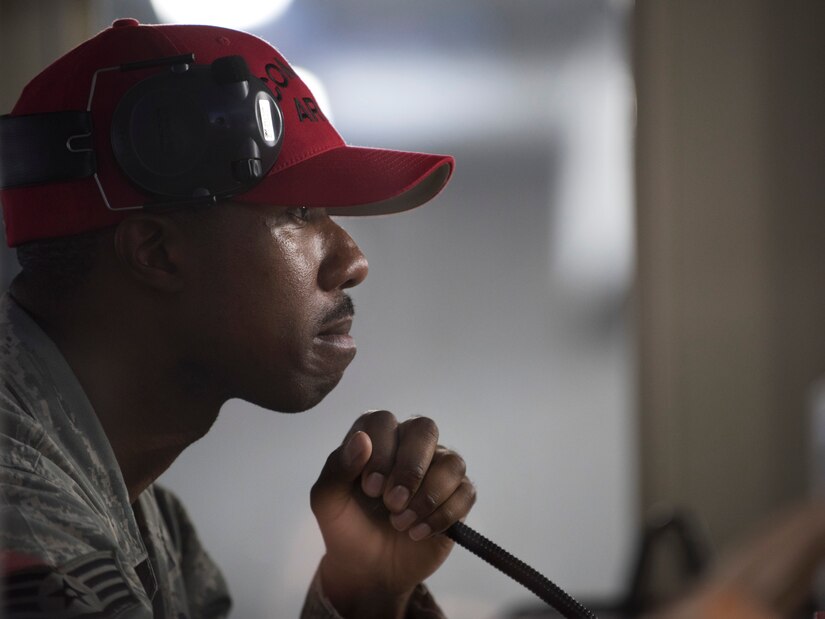 Staff Sgt. Aaron Robinson, chief range officer, instructs participants during the 2016 Elementary Level Excellence in Competition Rifle Match at Joint Base Andrews, Md., May 17. Robinson kept firing duration times and the pace of the competition throughout the day. (U.S. Air Force photo by Airman 1st Class Philip Bryant)