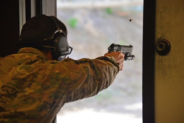 An Airman assigned to the 341st Security Forces Group participates in a shooting competition May 18, 2016, at Malmstrom Air Force Base, Mont. Nearly 40 Airmen and local police competed in honor of National Police Week. (U.S. Air Force photo/Airman Daniel Brosam)