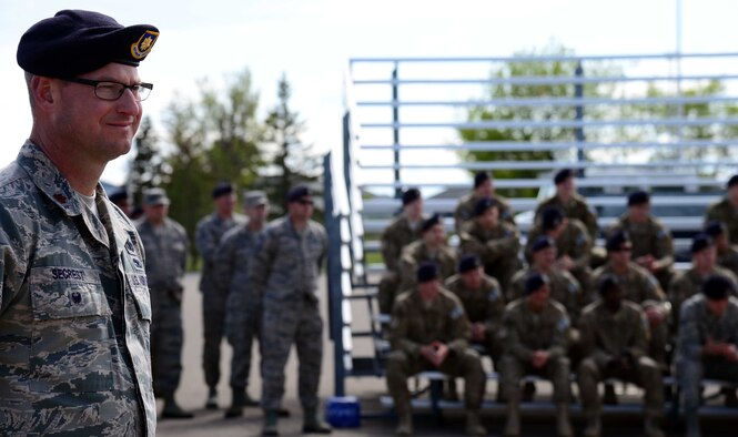 Maj. Justin Secrest, 341st Security Forces Group deputy commander, looks on at a retreat ceremony May 16, 2016, at Malmstrom Air Force Base, Mont. Malmstrom held the retreat to kick off National Police Week, which recognizes those in law enforcement who have made the ultimate sacrifice as well as those who continue to serve every day and the risks associated with that commitment. (U.S. Air Force photo/Airman 1st Class Magen M. Reeves)