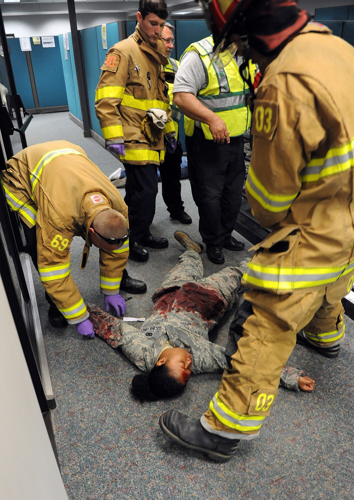 Team Robins conducted a series of exercises last week which included an active-shooter scenario involving airmen who were moulaged to portray victims. Shown here, first responders attend to simulated victims. (U.S. Air Force photo by Tommie Horton)