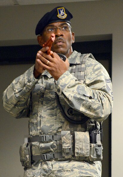 Team Robins conducted a series of exercises last week which included an active-shooter scenario involving airmen who were moulaged to portray victims. Shown here a 78th Security Forces Squadron defender helps secure Bldg. 255. (U.S. Air Force photo by Tommie Horton)