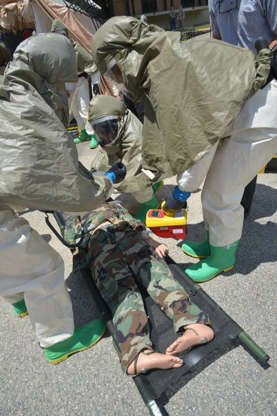 Airmen from the 78th Medical Group recently participated in a three-day, In-Place Patient Decontamination specialized class that included classroom training and hands-on instruction on shelter assembly, setting up a containment system for wastewater runoff and processing, and patient care during a chemical, biological, radiological or nuclear incident. (U.S. Air Force photo by Ray Crayton)