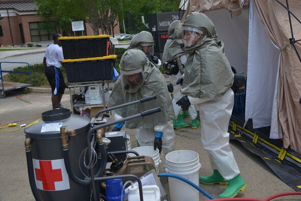Airmen from the 78th Medical Group recently participated in a three-day, In-Place Patient Decontamination specialized class that included classroom training and hands-on instruction on shelter assembly, setting up a containment system for wastewater runoff and processing, and patient care during a chemical, biological, radiological or nuclear incident. (U.S. Air Force photo by Ray Crayton)