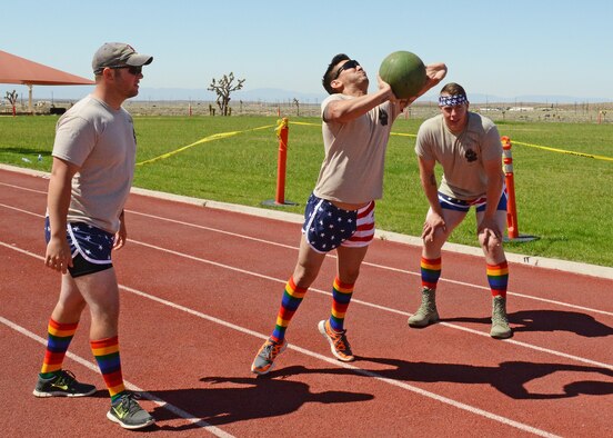 Several events were held during the Defender Olympics May 19, including a medicine ball throw where each team competed to see who can throw the ball the farthest in four tries. (U.S. Air Force photo by Kenji Thuloweit) 