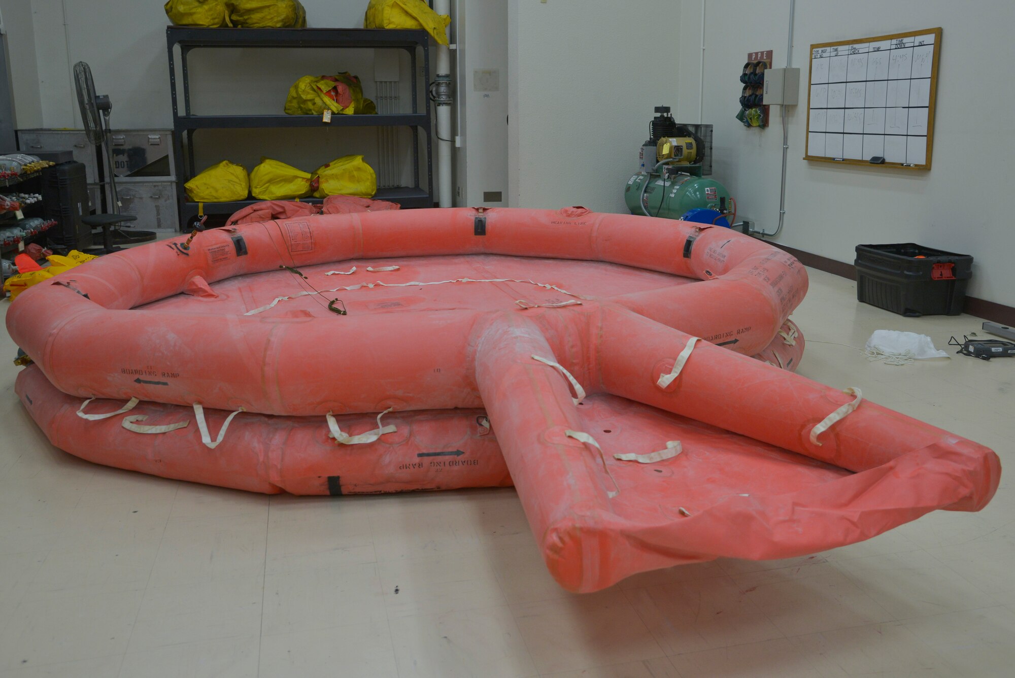 A life raft awaits inspection after being inflated at Yokota Air Base, Japan, May 17, 2016. Once inflated, the life raft will undergo a four-hour leakage test before it can be used on a C-130 Hercules. (U.S. Air Force photo by Senior Airman David Owsianka/Released)
