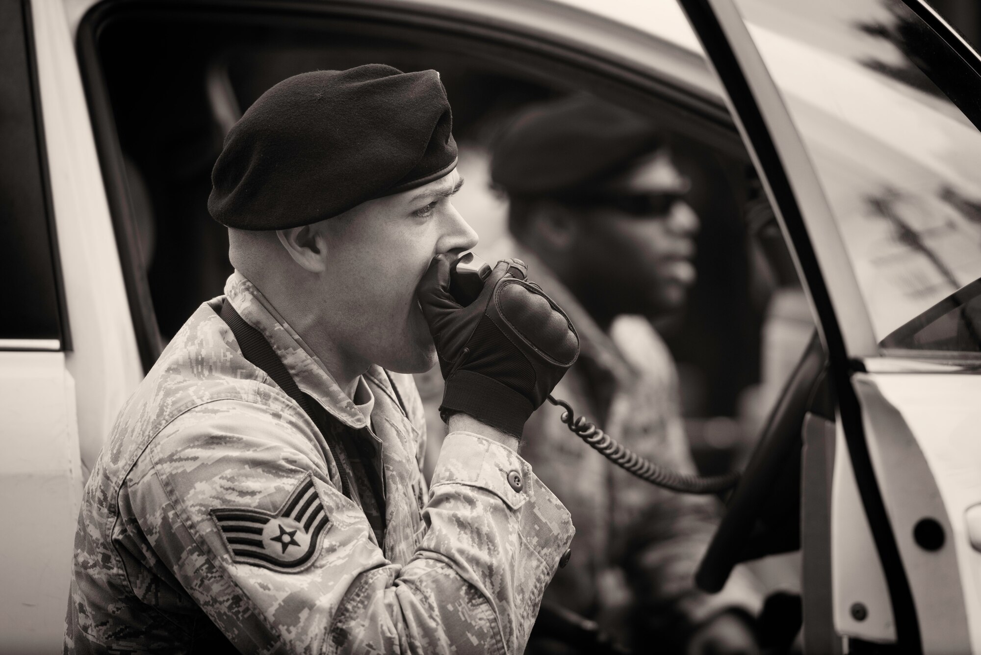 Staff Sgt. Nicholas Galbraith, 374th Security Forces Squadron military working dog handler, communicates with a simulated active shooter during Yokota’s Top Dog competition at Yokota Air Base, Japan, May 16, 2016. Seven canine teams competed in the event as part of Police Week, which honors Security Forces Airmen, Air Force Office of Special Investigations agents and all other law enforcement officers who have served. (U.S. Air Force photo by Airman 1st Class Elizabeth Baker/Released)