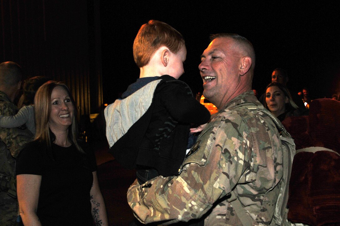 219th RED HORSE Squadron member Chief Master Sgt. Scott Fink greets a family member upon his return from his deployment to Southwest Asia. The returning Airmen were met by a reception of family members and friends in a hangar at Holman Aviation at the Great Falls International Airport May 7, 2016. (U.S. Air National Guard photo by Senior
Master Sgt. Eric Peterson)
