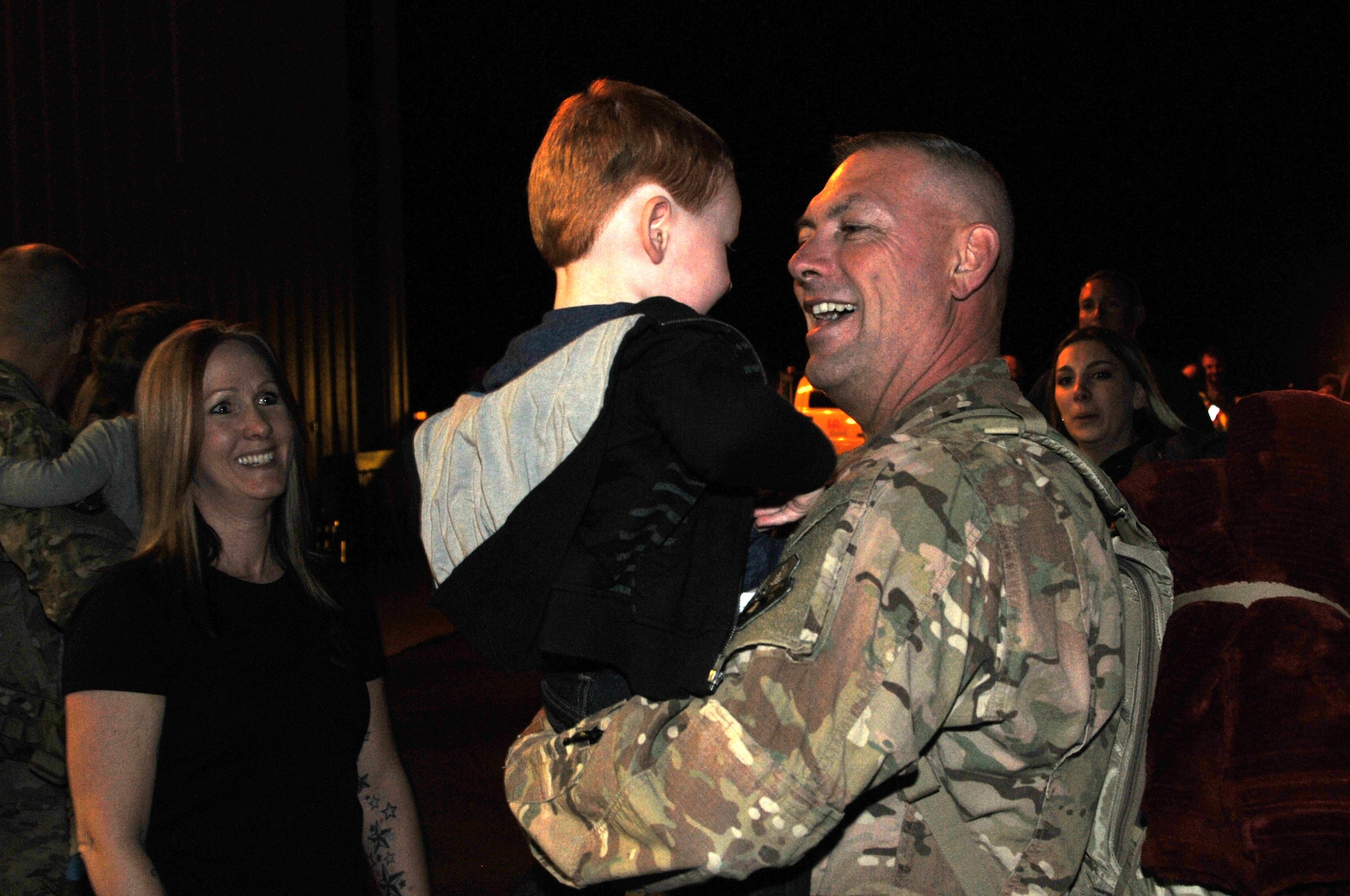 219th RED HORSE Squadron member Chief Master Sgt. Scott Fink greets a family member upon his return from his deployment to Southwest Asia. The returning Airmen were met by a reception of family members and friends in a hangar at Holman Aviation at the Great Falls International Airport May 7, 2016. (U.S. Air National Guard photo by Senior
Master Sgt. Eric Peterson)
