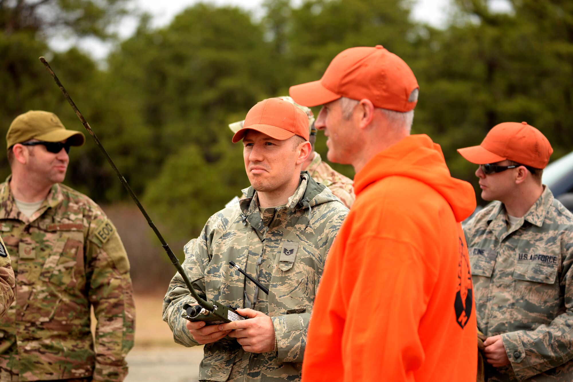 A picture of U.S. Air Force Staff Sgt. Javan Haley, heavy equipment operator with the 177th Fighter Wing Civil Engineering Squadron, preparing to remotely detonate C-4 explosives attached to previously dropped BDU-50 500 lb. concrete-filled practice bombs.