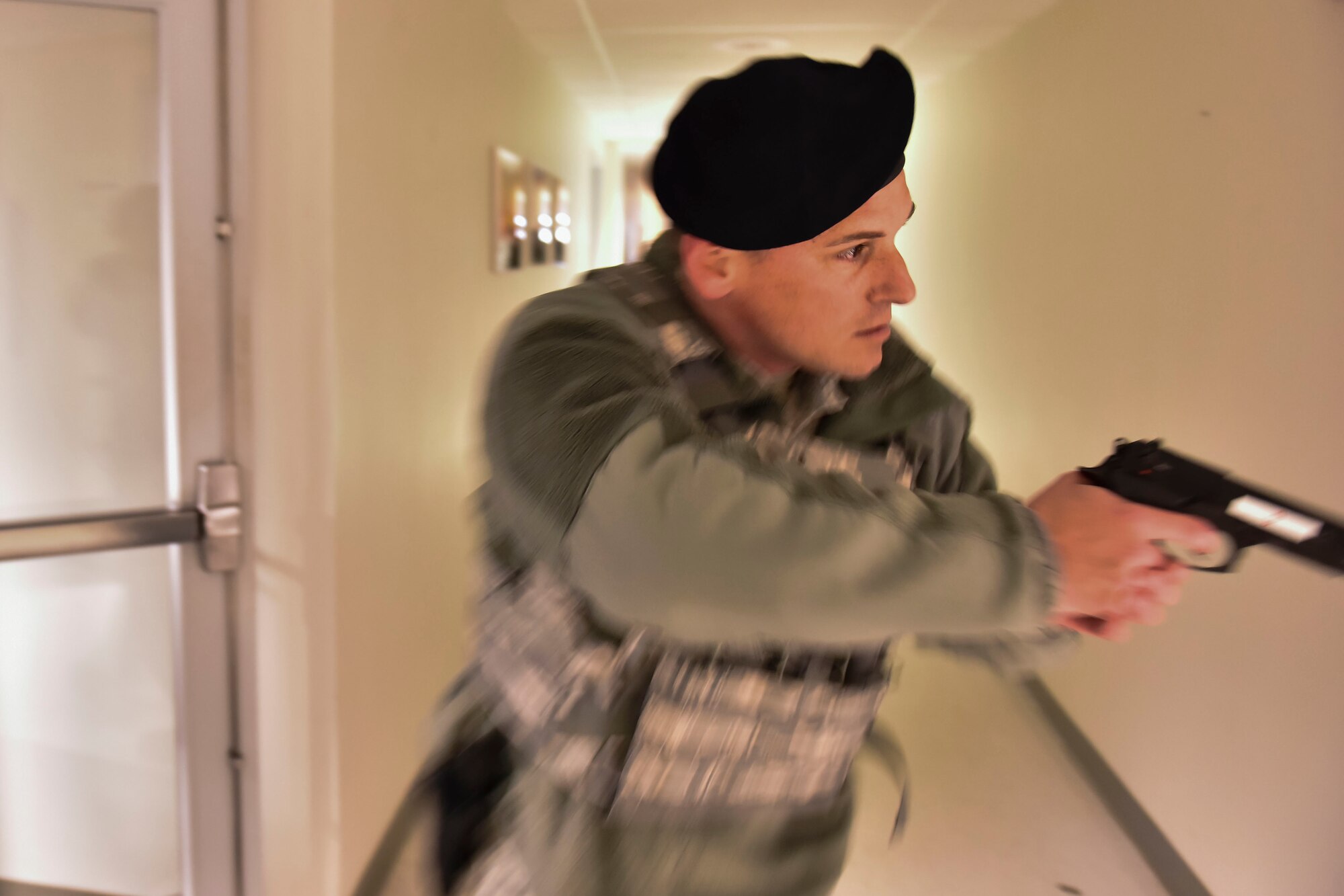 U.S. Air Force Master Sgt. Nick Muir, Security Forces specialist at the 180th Fighter Wing in Swanton, Ohio, enters a building on base after the initial sweep for suspects during an active shooter exercise on May 15, 2016. The 180th performed a base-wide active shooter response exercise and inspection to prepare Airmen to survive an incident on base or in their civilian lives. (Ohio Air National Guard photo by Tech. Sgt. Nic Kuetemeyer/released)