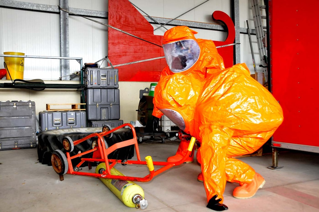 SPANGDAHLEM, Germany - Firefighters respond to a possible chemical spill during a duel-component training mission with the 104th Fighter Wing National Guardsman and their 52nd Fighter Wing, active duty counterparts, May 18, 2016. Nearly 100 Airmen from the 104th Fighter Wing deployed to Germany for annual training in an effort to support total force integration which combines reservists with active duty Service Members to create one seamless Air Force (U.S. Air National Guard photo by Senior Airman Loni Kingston/Released)