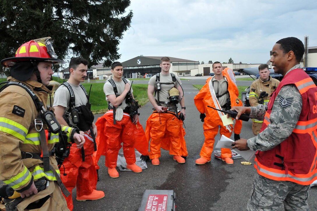 SPANGDAHLEM, Germany - Incident Commander, Tech. Sgt. Mario Rainge, from the 52nd Fighter Wing trains firefighters from the 104th Fighter Wing, Barnes Air National Guard Base, Mass., and their active duty counterparts, May 18, 2016. Nearly 100 Airmen from the 104th Fighter Wing deployed to Germany for annual training in an effort to support total force integration which combines reservists with active duty Service Members to create one seamless Air Force (U.S. Air National Guard photo by Senior Airman Loni Kingston/Released)