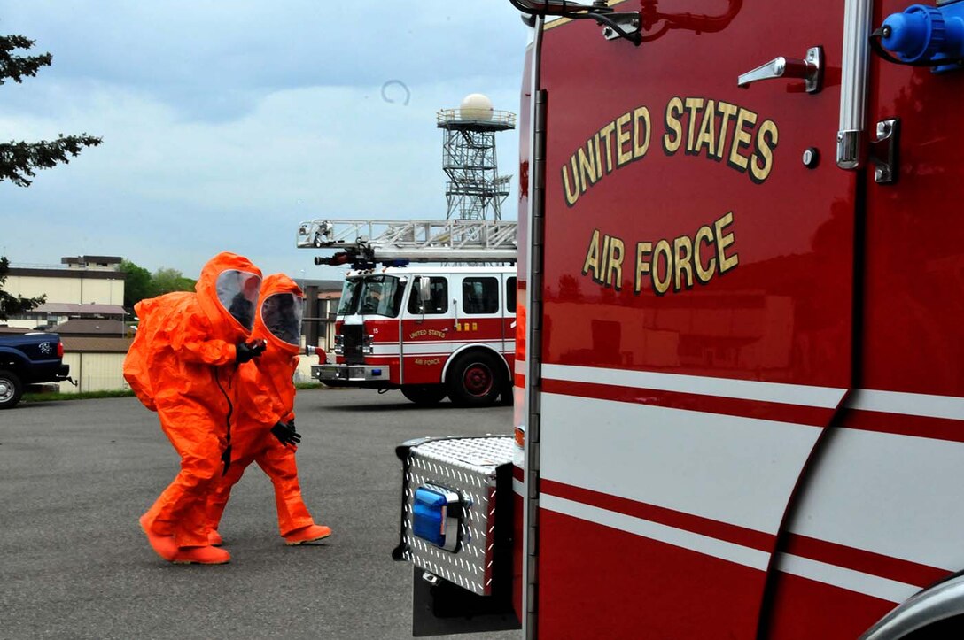 SPANGDAHLEM, Germany - Firefighters respond to a possible chemical spill during a duel-component training mission with the 104th Fighter Wing National Guardsman and their 52nd Fighter Wing, active duty counterparts, May 18, 2016. Nearly 100 Airmen from the 104th Fighter Wing deployed to Germany for annual training in an effort to support total force integration which combines reservists with active duty Service Members to create one seamless Air Force (U.S. Air National Guard photo by Senior Airman Loni Kingston/Released)