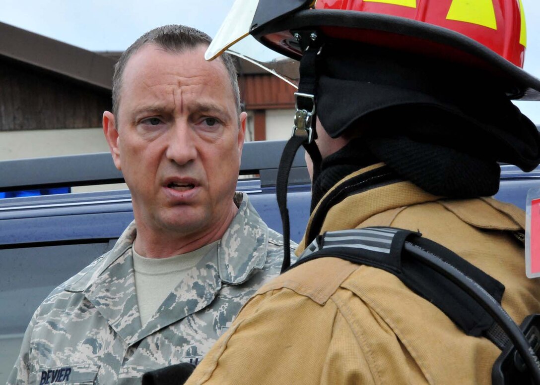 SPANGDAHLEM, Germany - Assistant Fire Chief, Master Sgt. Steven Bevier, from the 52nd Fighter Wing discusses rescue procedures with Tech. Sgt. Karl Reinholz, firefighter from the 104th Fighter Wing, Barnes Air National Guard Base, Mass., May 18, 2016. Nearly 100 Airmen from the 104th Fighter Wing deployed to Germany for annual training in an effort to support total force integration which combines reservists with active duty Service Members to create one seamless Air Force (Air National Guard photo by Senior Airman Loni Kingston/Released).