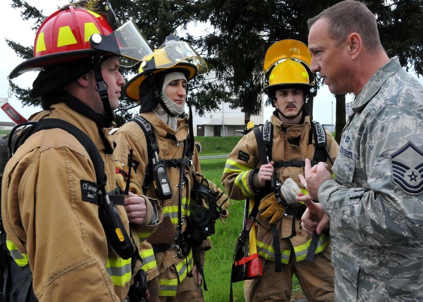 SPANGDAHLEM, Germany - Assistant Fire Chief, Master Sgt. Steven Bevier, from the 52nd Fighter Wing trains National Guard firefighters from the 104th Fighter Wing, Barnes Air National Guard Base, Mass., and active duty firefighters from the 52nd Fighter Wing, May 18, 2016. Airmen train in real-world scenarios in preparation for combat deployment.  Nearly 100 Airmen from the 104th Fighter Wing deployed to Germany for annual training in an effort to support total force integration which combines reservists with active duty Service Members to create one seamless Air Force (Air National Guard photo by Senior Airman Loni Kingston/Released)