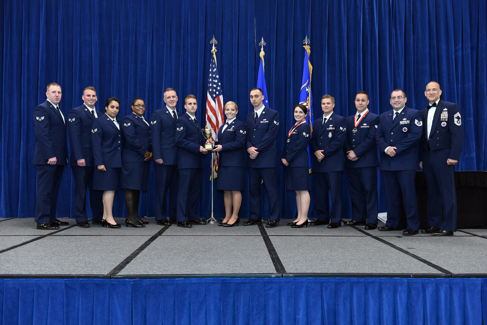 MCGHEE TYSON AIR NATIONAL GUARD BASE, Tenn. - Airmen in the B-Flight, take the honor flight award here, May 18, 2016, for the Airman leadership school, class 16-5, during the graduation banquet at the Chief Master Sgt. Paul H. Lankford Enlisted Professional Military Education Center. (U.S. Air National Guard photo by Master Sgt. Mike R. Smith/Released)