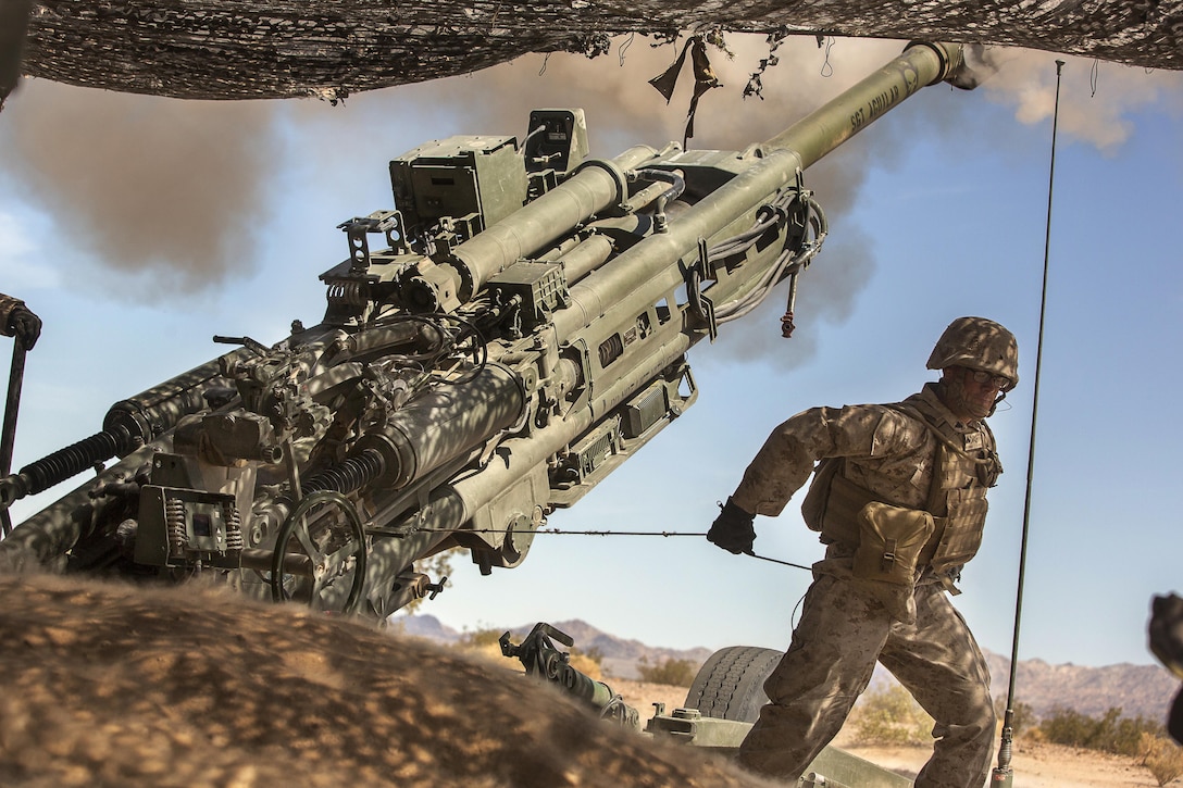 A Marine with 3rd Battalion, 11th Marine Regiment, fire a 155mm M777A2 Lightweight Towed Howitzer in the Lead Mountain Training Area aboard the Marine Corps Air Ground Combat Center Twentynine Palms, Calif., May 3, 2016. (Official Marine Corps photo by Lance Cpl. Levi Schultz/Released)
