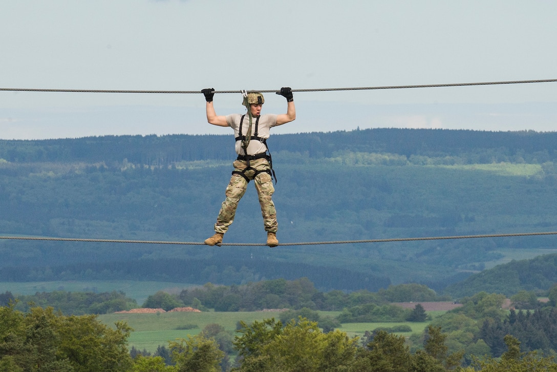 Army Spc. Victor Vice crosses a cable line during the obstacle portion of the 10th Army Air and Missile Defense Command’s 2016 Best Warrior Competition in Baumholder, Germany, May 17, 2016. DoD photo by Air Force Tech. Sgt. Brian Kimball