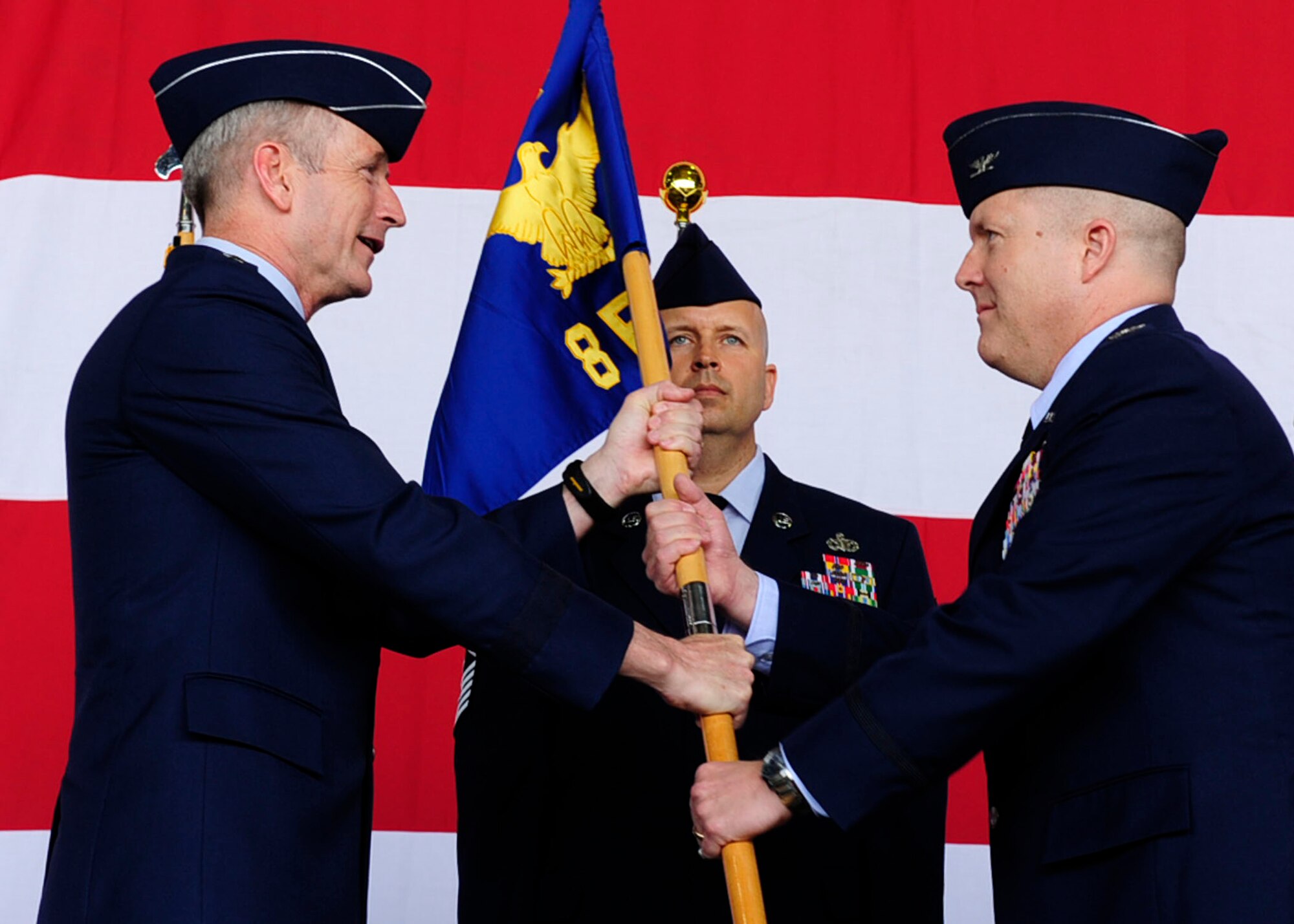 Lt. Gen. Terrence O’Shaughnessy, 7th Air Force commander, transfers command to Col. Todd “Wolf” Dozier, 8th Fighter Wing commander, during the 8th FW change of command ceremony at Kunsan Air Base, Republic of Korea, May 20, 2016. (U.S. Air Force photo by Staff Sgt. Chelsea Browning/Released)