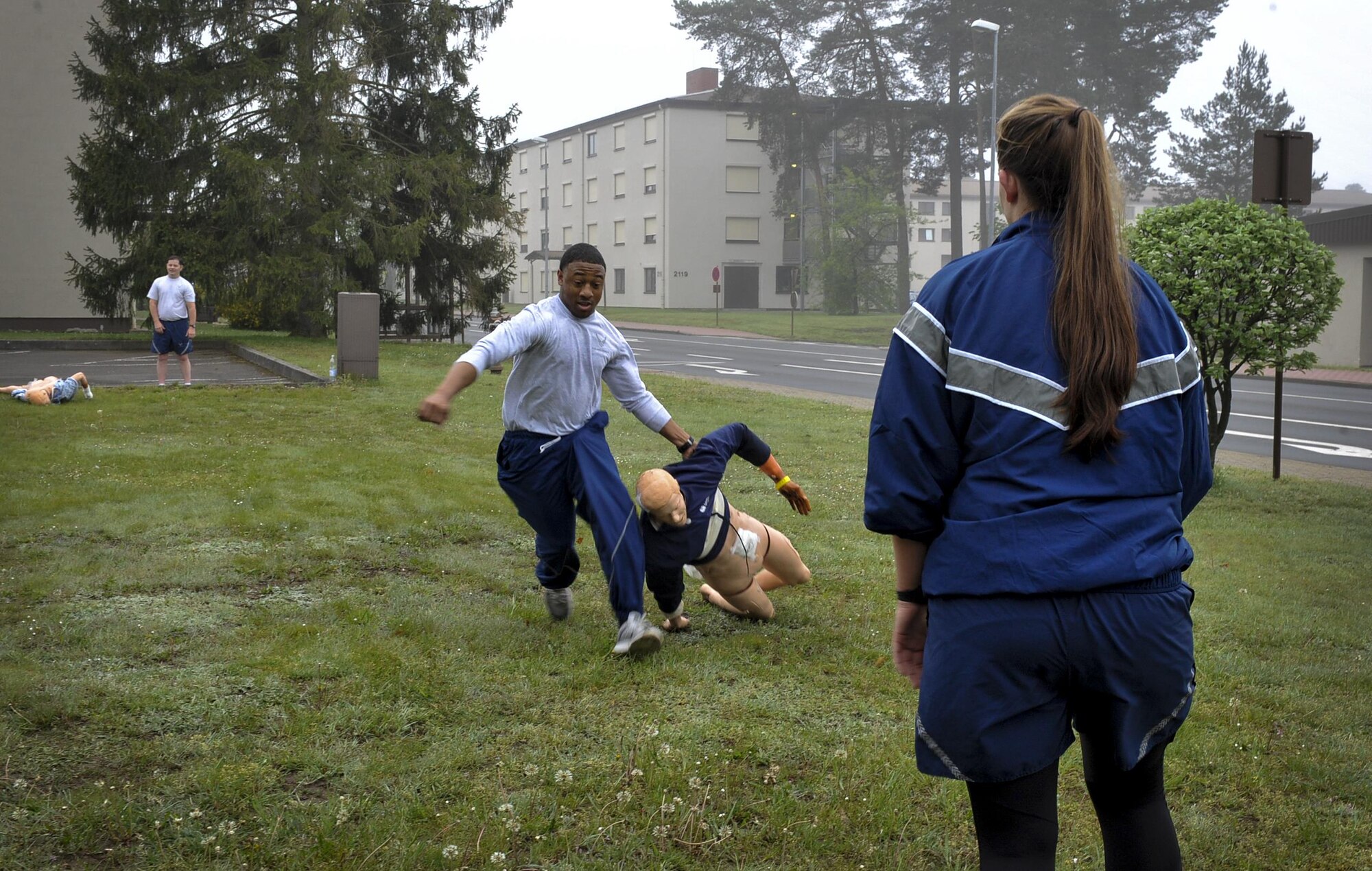 Senior Airman Clifford Hughley, 86th Aeromedical Evacuation Squadron technician, drags a dummy during a nurses and technicians scavenger hunt May 11, 2016, at Ramstein Air Base, Germany.  Airmen spent time each day for a week participating in camaraderie-building activities. (U.S. Air Force photo/ Senior Airman Larissa Greatwood)
