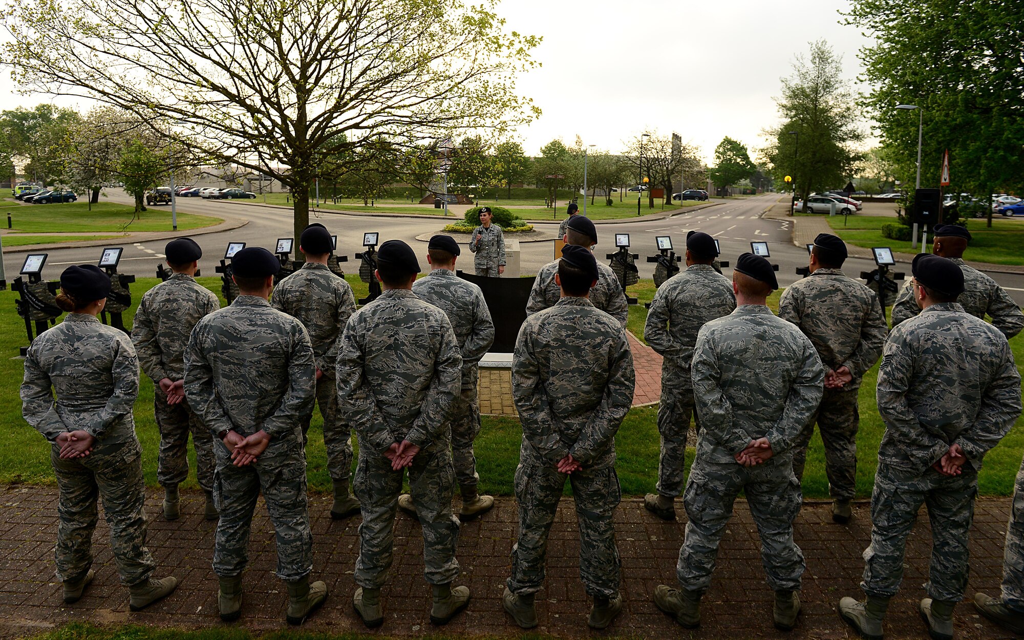 U.S. Air Force Lt. Col. Tara Opielowski, 48th Security Forces Squadron commander addresses Spartans and Defenders from the 48th and 100th SFS during an opening ceremony kicking off National Police Week at Royal Air Force Lakenheath, England May 13. This year, both Lakenheath and Mildenhall Defenders began the week with a six mile ruck march, followed by additional events throughout May 16-20. These included a shooting competition, the Defender challenge obstacle course, military working dog competition, community awareness display and closing ceremony. (U.S. Air Force photo/ Tech. Sgt. Matthew Plew)