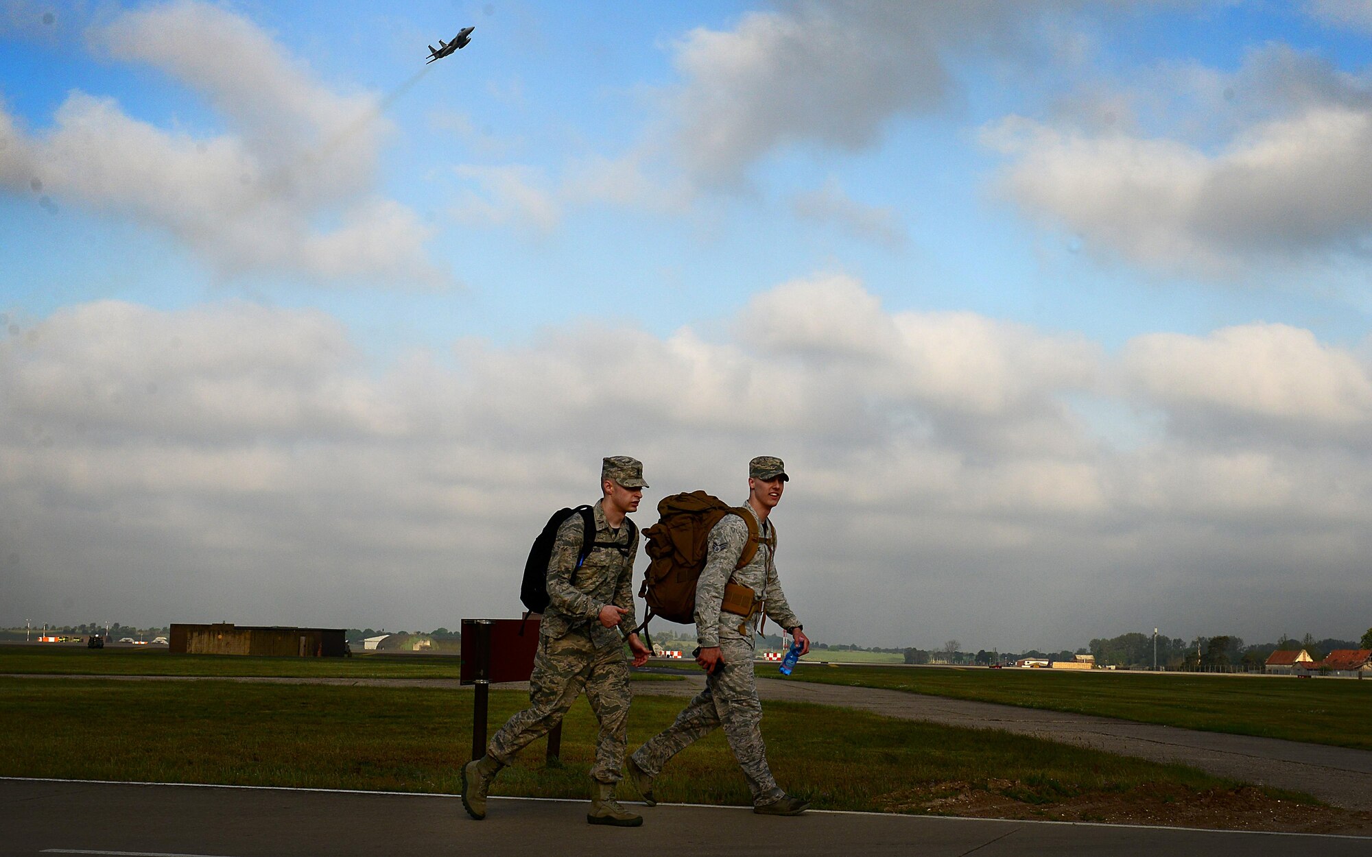 Spartans and Defenders from the 48th and 100th Security Forces Squadrons ruck march six miles to kick-off National Police Week at Royal Air Force Lakenheath, England May 13. The event is part of U.S. National Police week, which recognizes the men, women and their canine companions who wear the badge. (U.S. Air Force photo/ Tech. Sgt. Matthew Plew)