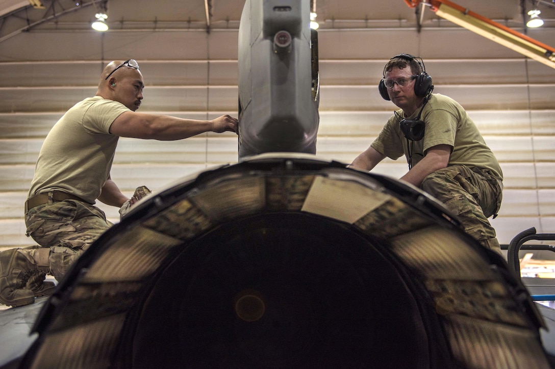 Air Force Tech. Sgts. Christopher Melrose, right, and Rene Garcia checks the panel on an F-16C Fighting Falcon aircraft during routine phase maintenance at Bagram Airfield, Afghanistan, May 18, 2016. Melrose and Garcia are phase technicians assigned to the 455th Expeditionary Aircraft Maintenance Squadron. Air Force photo by Senior Airman Justyn M. Freeman