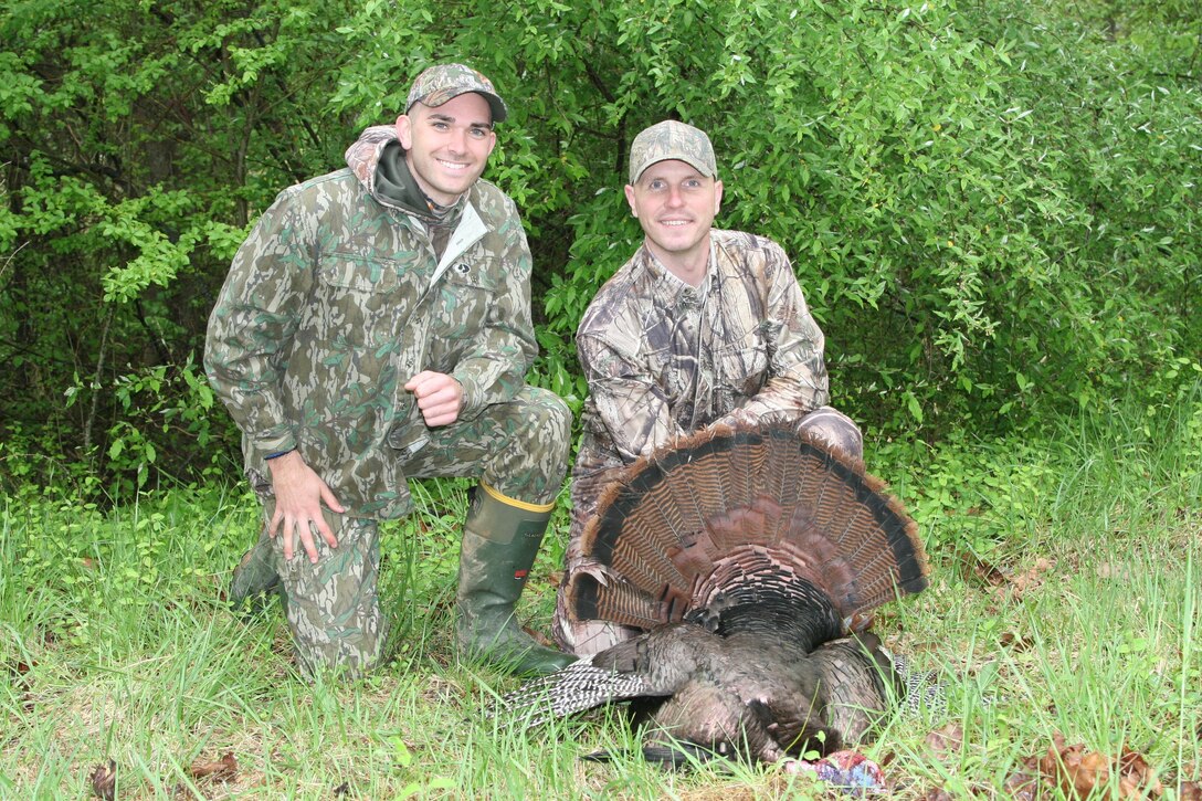 Kyle Allen, a Virginia state law enforcement officer, and Capt. Jacob Johnson, Marine Corps Systems Command, pose with a 20-pound turkey Johnson shot during a hunt aboard Quantico Apr. 29. The hunt was sponsored by Quantico National Resources and Environmental Activities and supported by the Quantico Injured Military Sportsmen Association.
