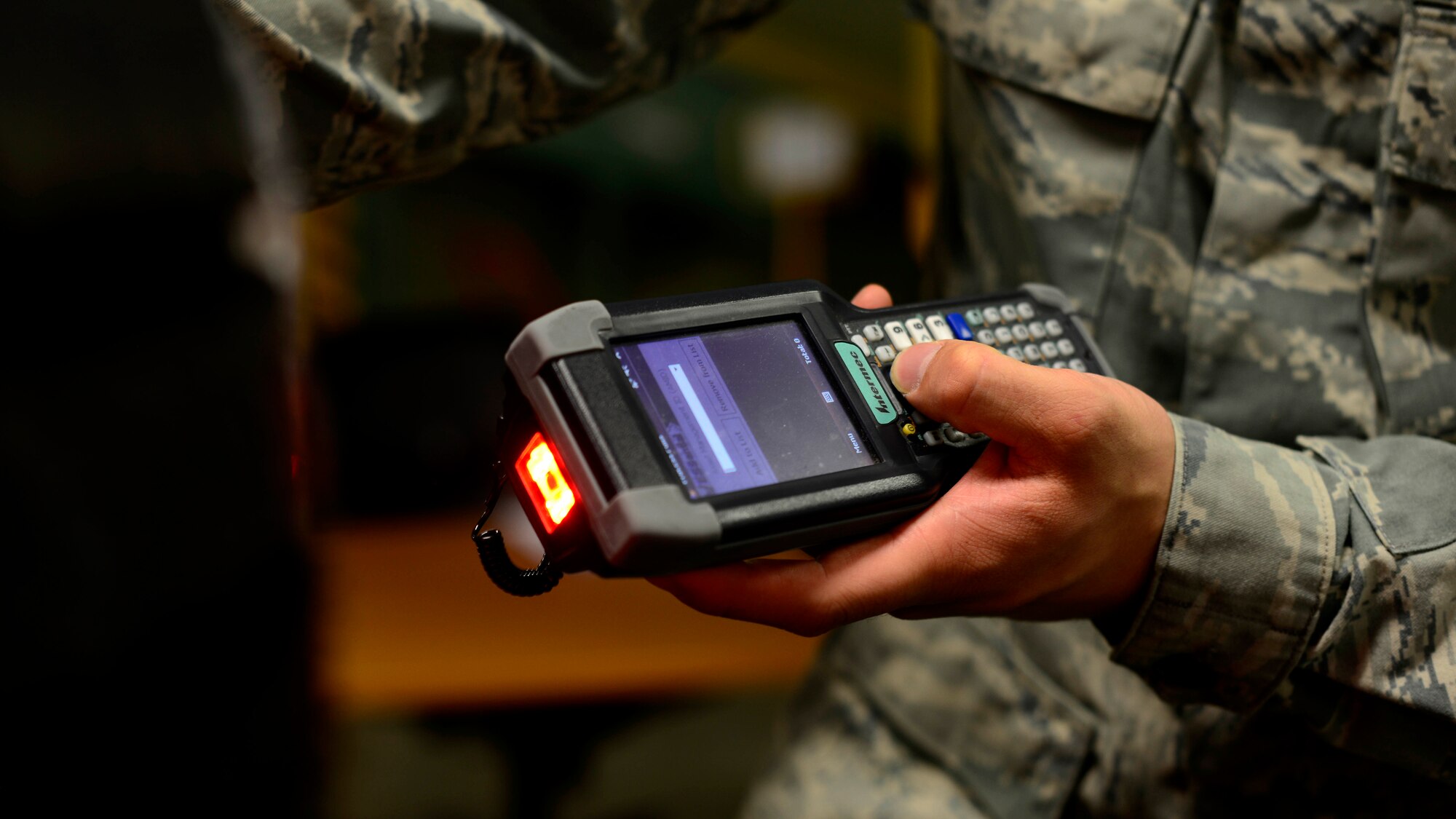Senior Airman Tyler Wandtke, 31st Logistics Readiness Squadron aircraft parts store journeyman, uses a hand held terminal to log items, May 19, 2016 at Aviano Air Base, Italy. Wandtke used his passion for technology to create Enterprise Solution Supply— also known as ESSential, which streamlines organization of collected data. (U.S. Air Force photo by Senior Airman Areca T. Bell/Released)