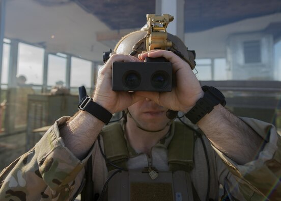 An Air Force special tactics Airman searches the area during close air support training at exercise Emerald Warrior 16 over Eglin Range, Fla., May 11, 2016. Emerald Warrior is a U.S. Special Operations Command-sponsored mission rehearsal exercise during which joint special operations forces train to respond to real and emerging worldwide threats. (U.S. Air Force photo/Senior Airman Trevor T. McBride)