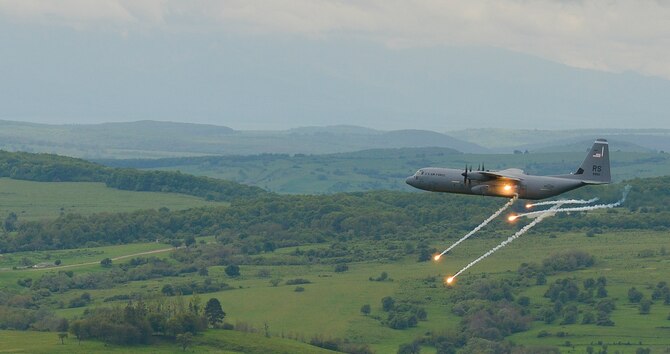 A C-130J Super Hercules from the 37th Airlift Squadron fires flares as it performs anti-aircraft fire tests during exercise Carpathian on May 9, 2016, in Romania. The 37th AS, from Ramstein Air Base, Germany, began participating in off-station training deployments with Romania as early as 1996, allowing the U.S. Air Force to work with NATO allies to develop and improve ready air forces capable of maintaining regional security. (U.S. Air Force photo/Airman 1st Class Lane Plummer)