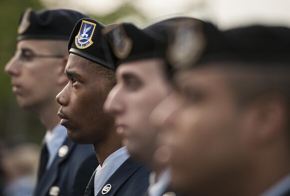 A row of 96th Security Forces Squadron Airmen stand at parade rest during the Peace Officers’ Memorial Ceremony on May 16, 2016, in Fort Walton Beach, Fla.  The ceremony was to honor fallen police officers from the previous year by reading their names aloud. Security forces Airmen from Eglin Air Force Base, Fla., and Hurlburt Field, Fla., attended and participated in the event. The ceremony was one of many events that took place during National Police Week. (U.S. Air Force photo/Samuel King Jr.)